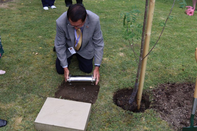 Councillor for West Ecclesfield Ward, Alan Hooper, placing the time capsule into the ground