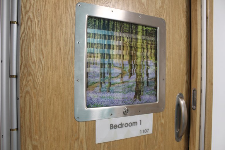 Bedroom door window with artwork