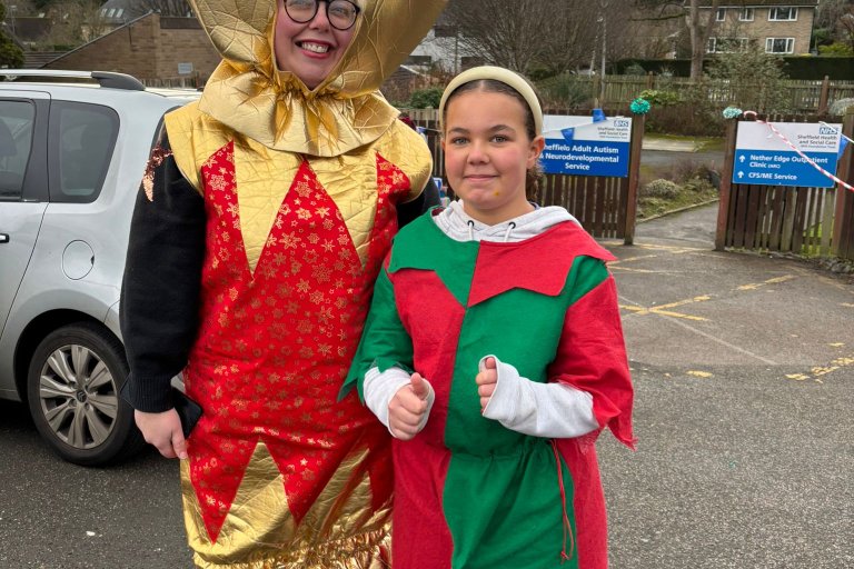 People smiling in Christmas and running gear at charity event